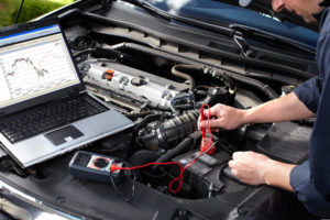 Auto Mechanic Running a Diagnostic on Engine